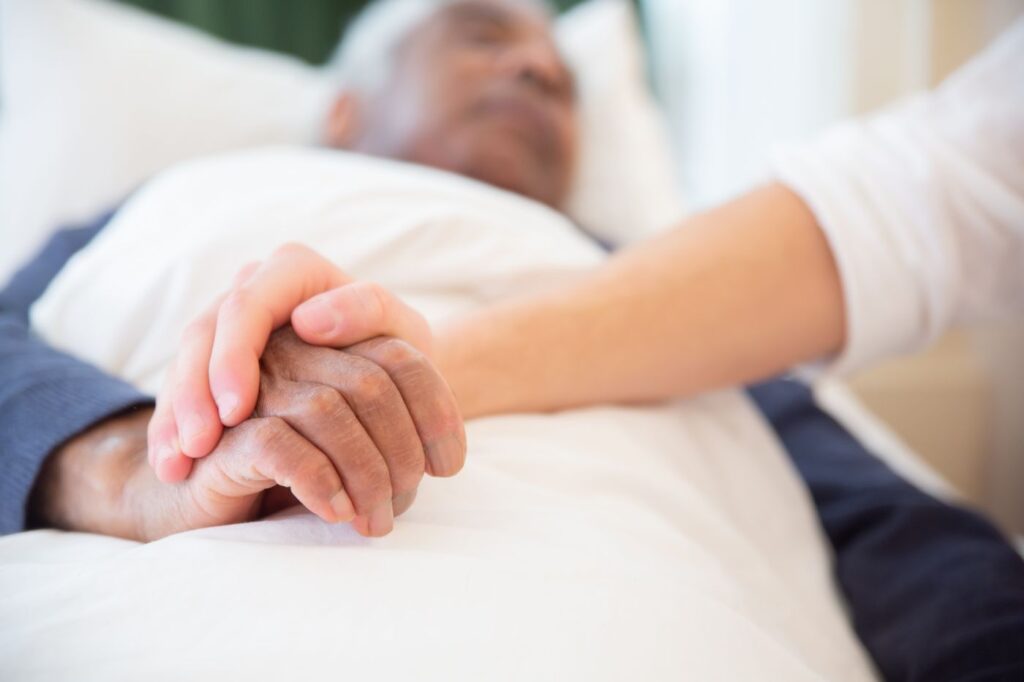 Care professional supporting an older adult