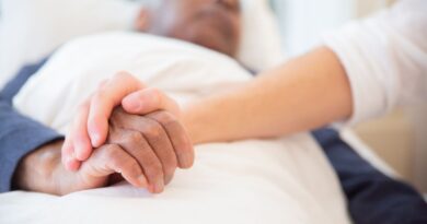 Care professional supporting an older adult