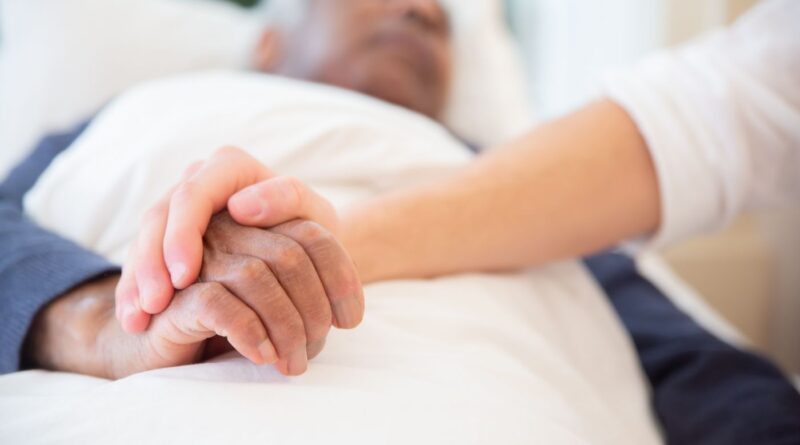 Care professional supporting an older adult