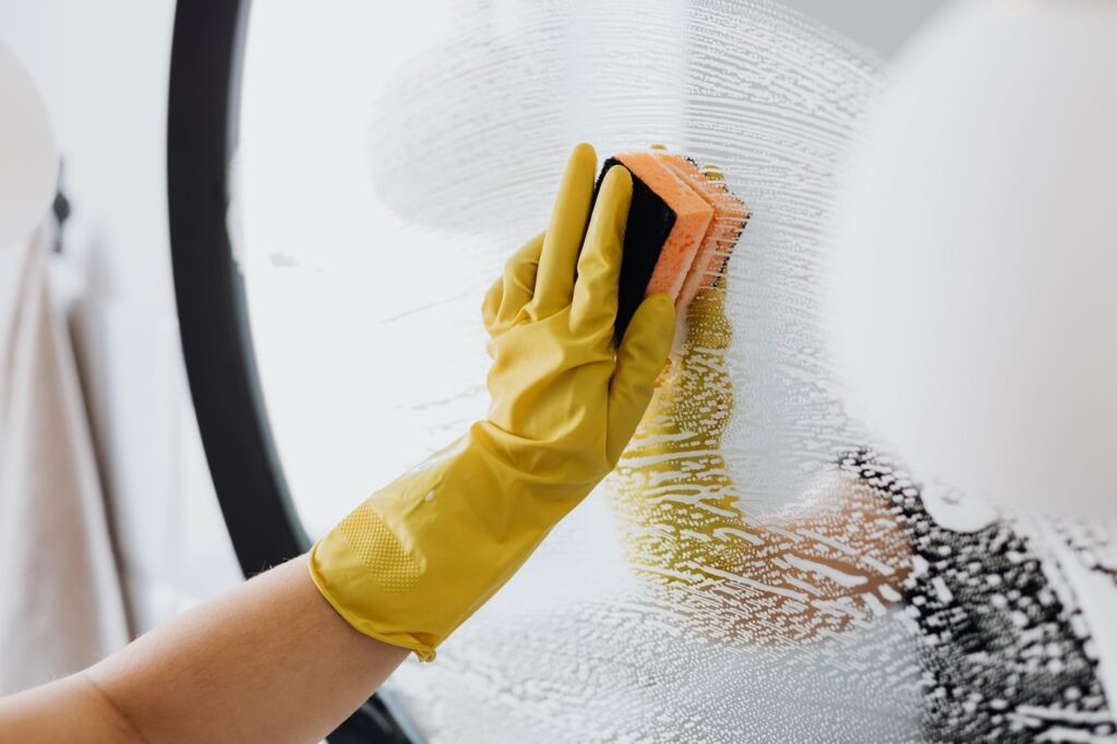 Professional cleaner carrying out cleaning duties