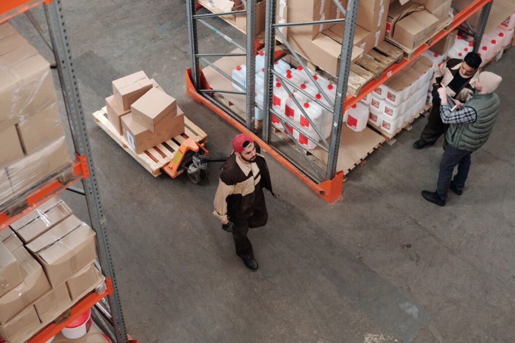 Warehouse worker handling stock in a distribution facility