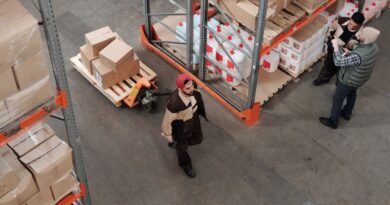Warehouse worker handling stock in a distribution facility
