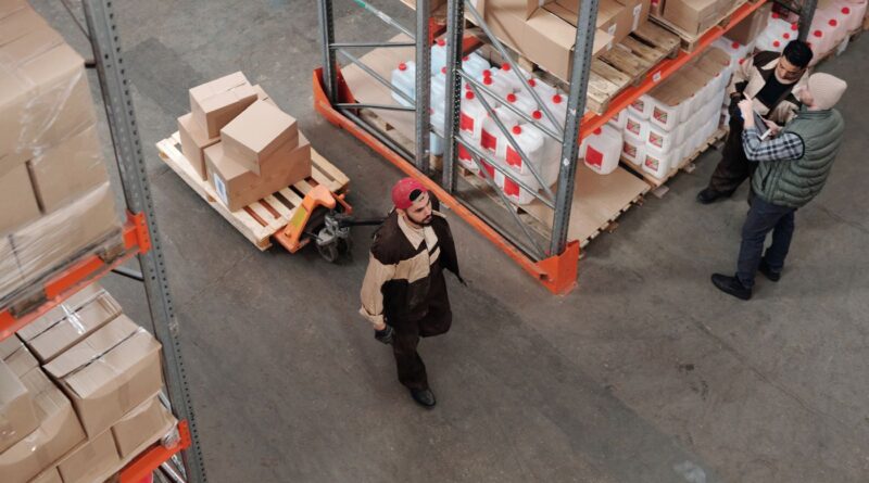 Warehouse worker handling stock in a distribution facility